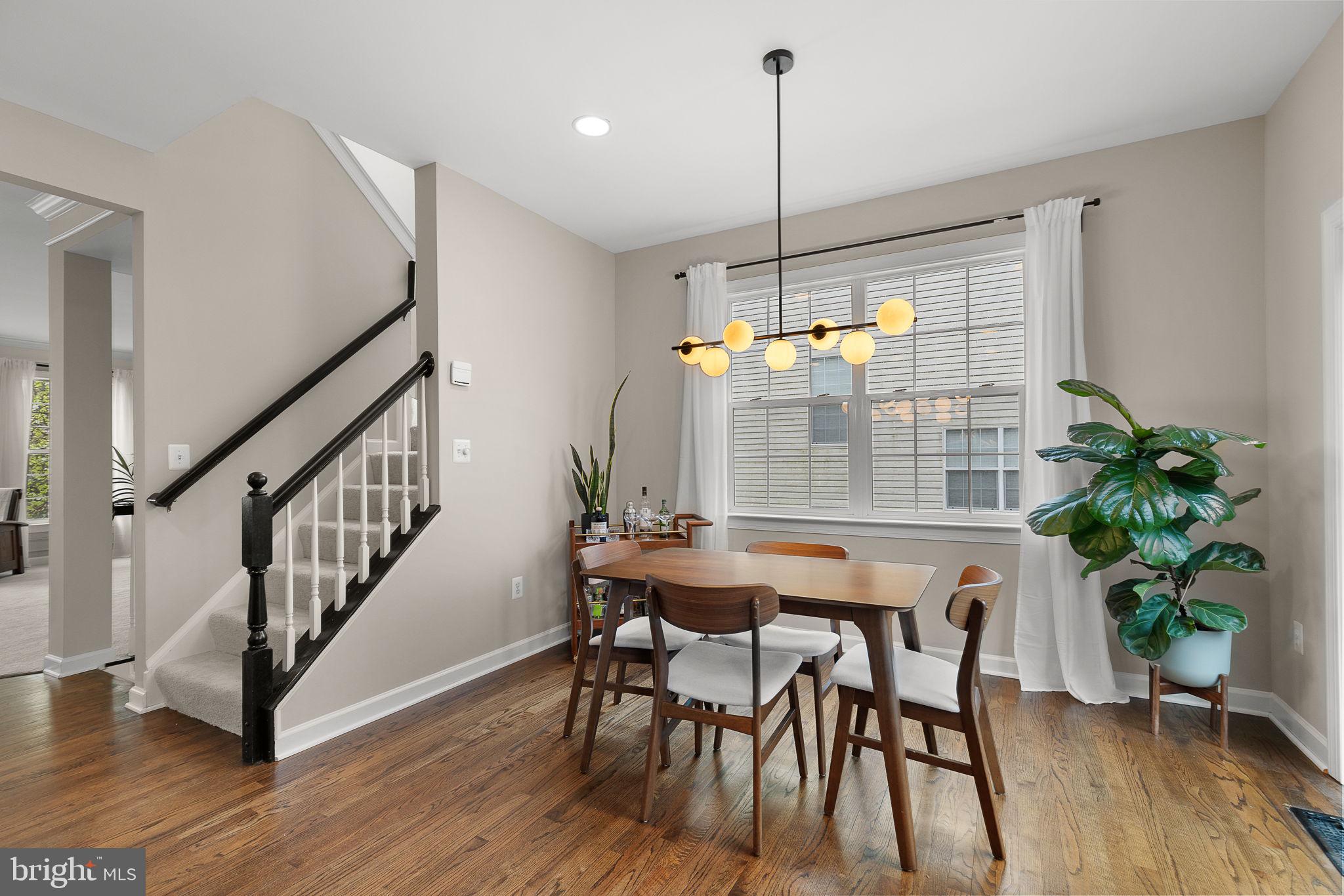 15686 Avocet Loop Woodbridge, VA 22191 - Photo 15 of 33 a view of a dining room with furniture window and wooden floor