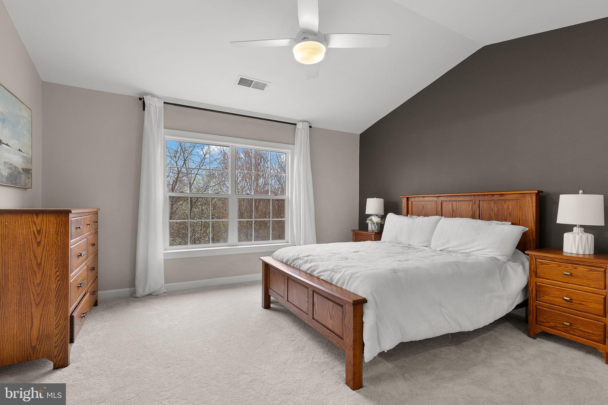 15686 Avocet Loop Woodbridge, VA 22191 - Photo 18 of 33 a bed sitting in a room next to a window