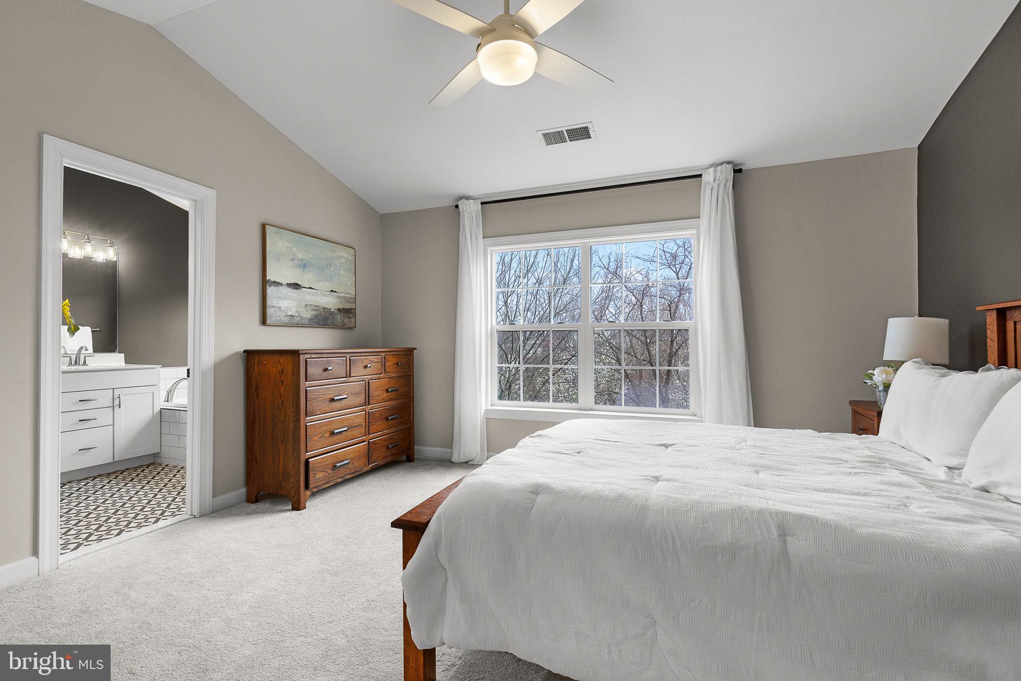 15686 Avocet Loop Woodbridge, VA 22191 - Photo 19 of 33 a bedroom with a bed dresser and a window