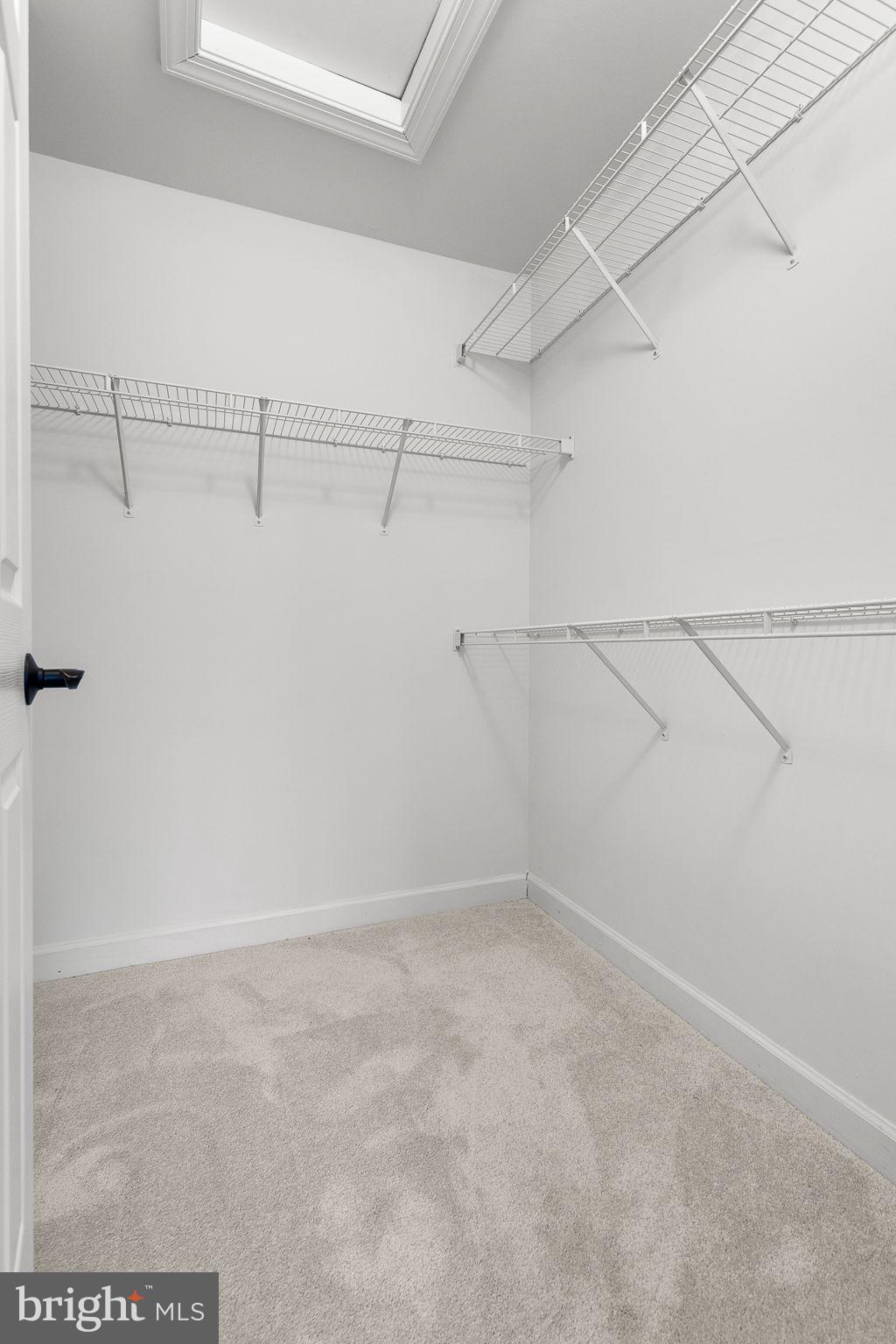 15686 Avocet Loop Woodbridge, VA 22191 - Photo 21 of 33 a view of a room with racks on the wall