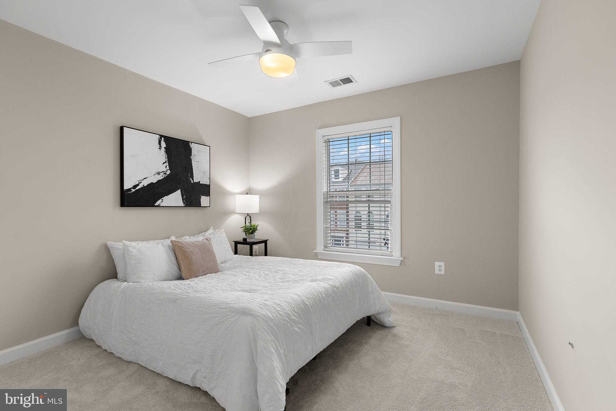 15686 Avocet Loop Woodbridge, VA 22191 - Photo 22 of 33 a bedroom with a bed and a window