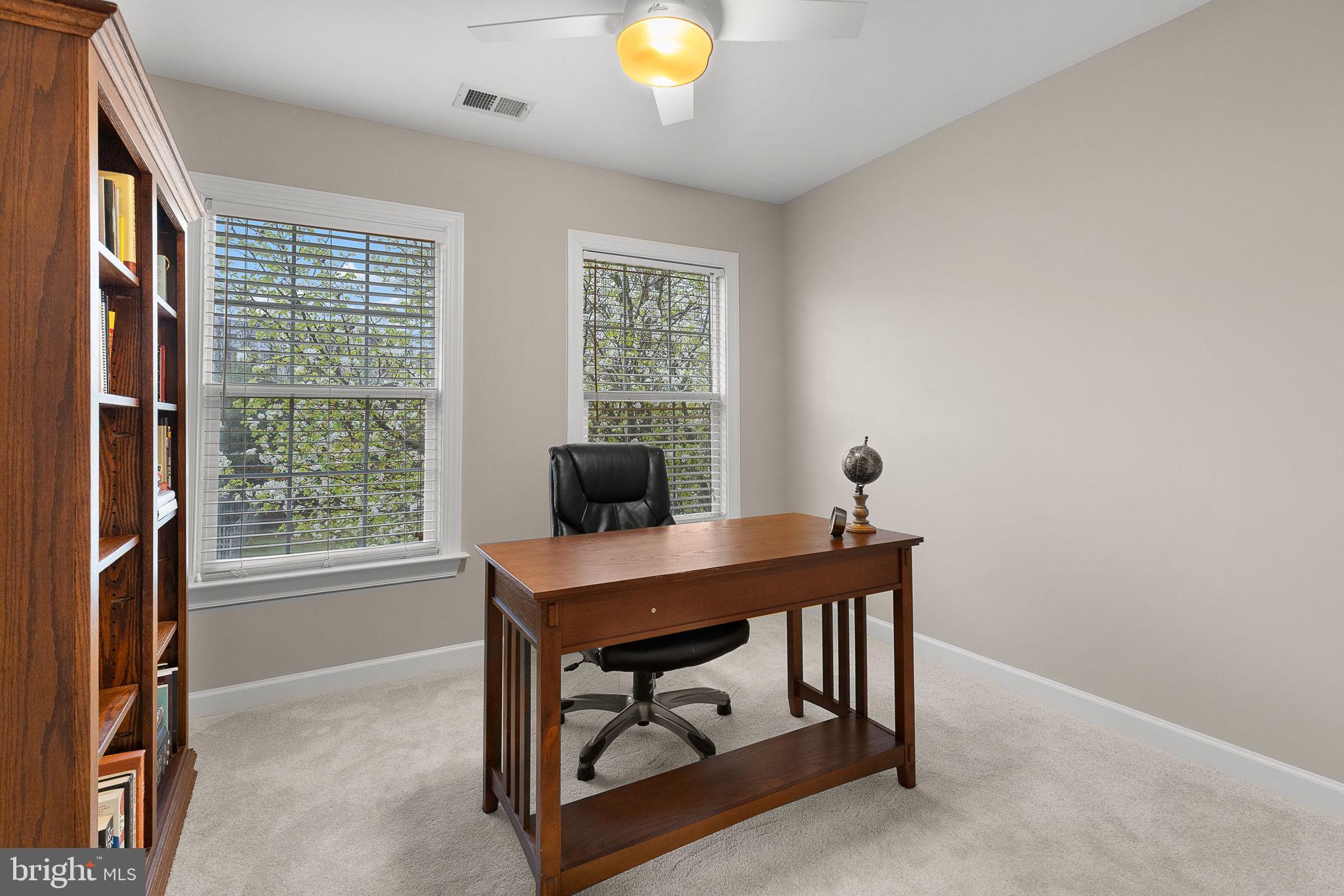15686 Avocet Loop Woodbridge, VA 22191 - Photo 23 of 33 a view of a workspace with furniture and a window