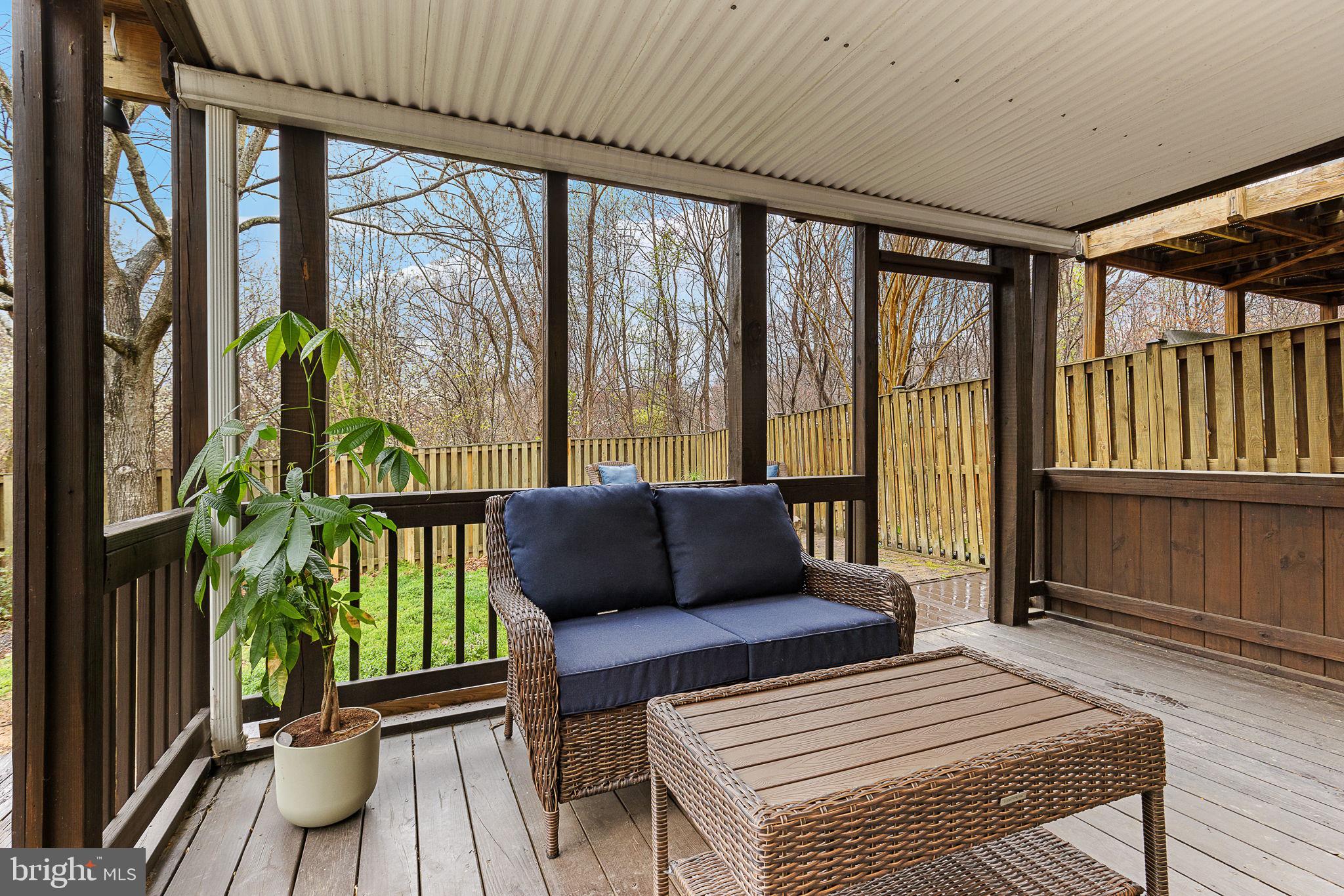 15686 Avocet Loop Woodbridge, VA 22191 - Photo 29 of 33 a living room with furniture and a floor to ceiling window