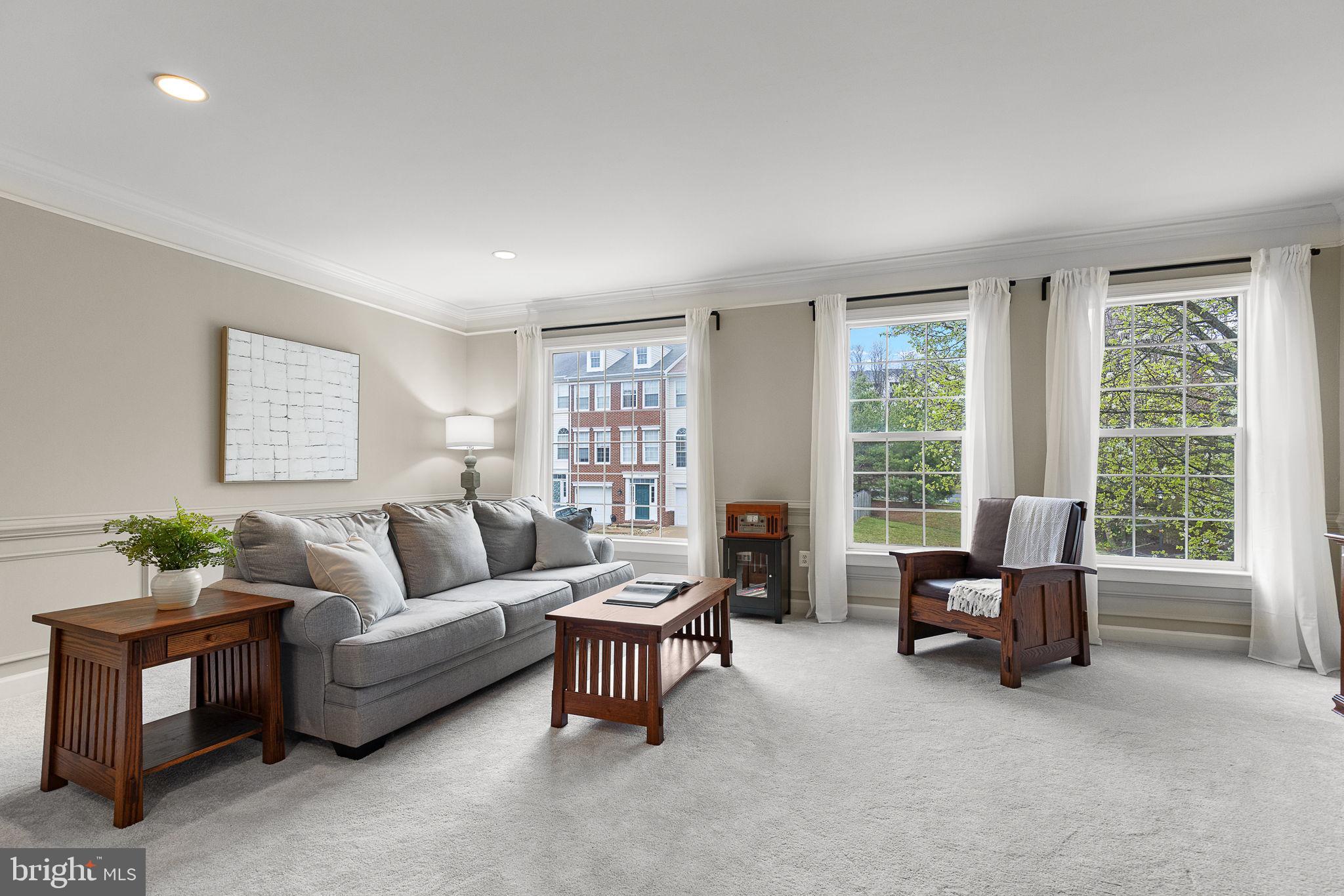 15686 Avocet Loop Woodbridge, VA 22191 - Photo 3 of 33 a living room with furniture and a large window