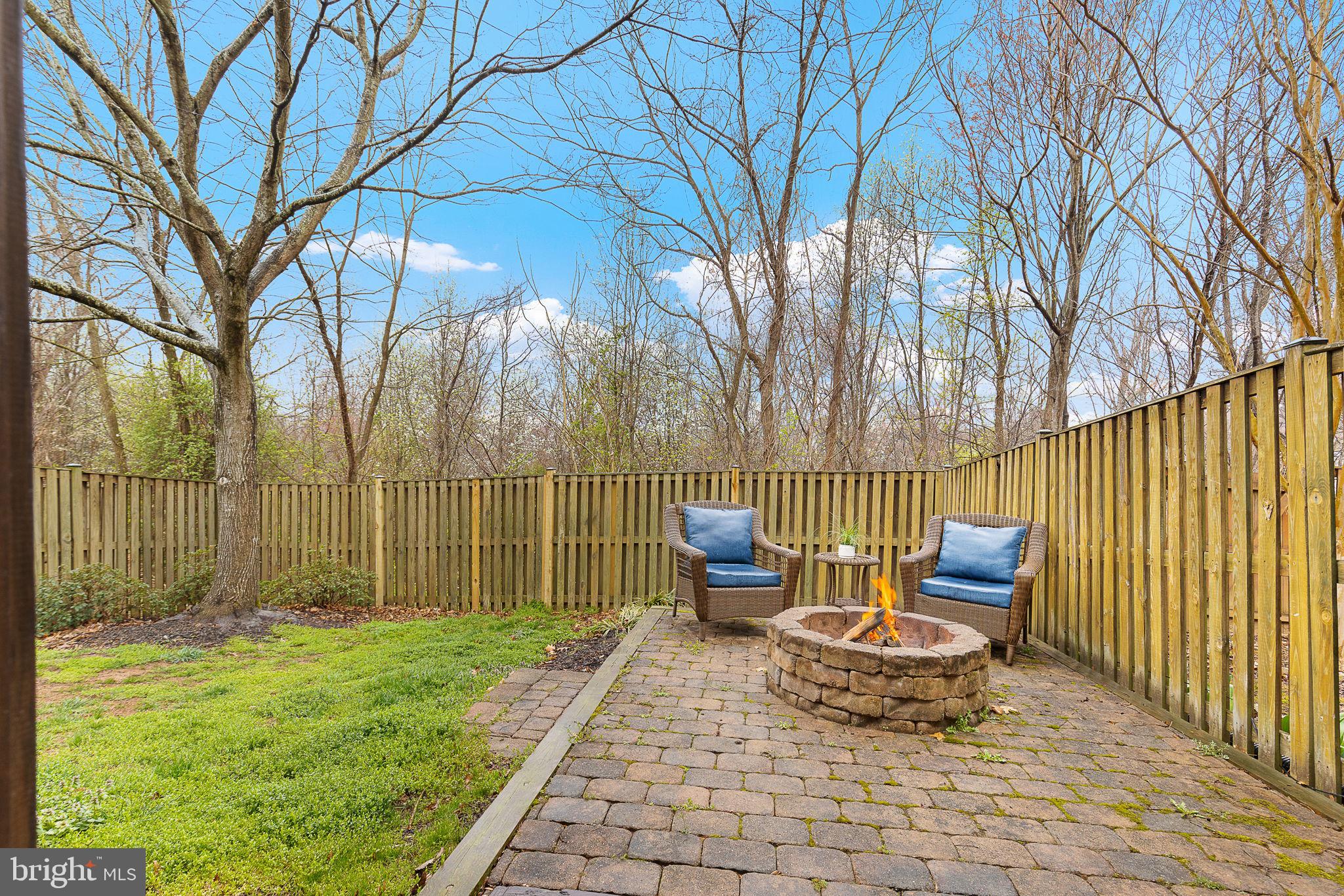 15686 Avocet Loop Woodbridge, VA 22191 - Photo 31 of 33 a backyard of a house with table and chairs