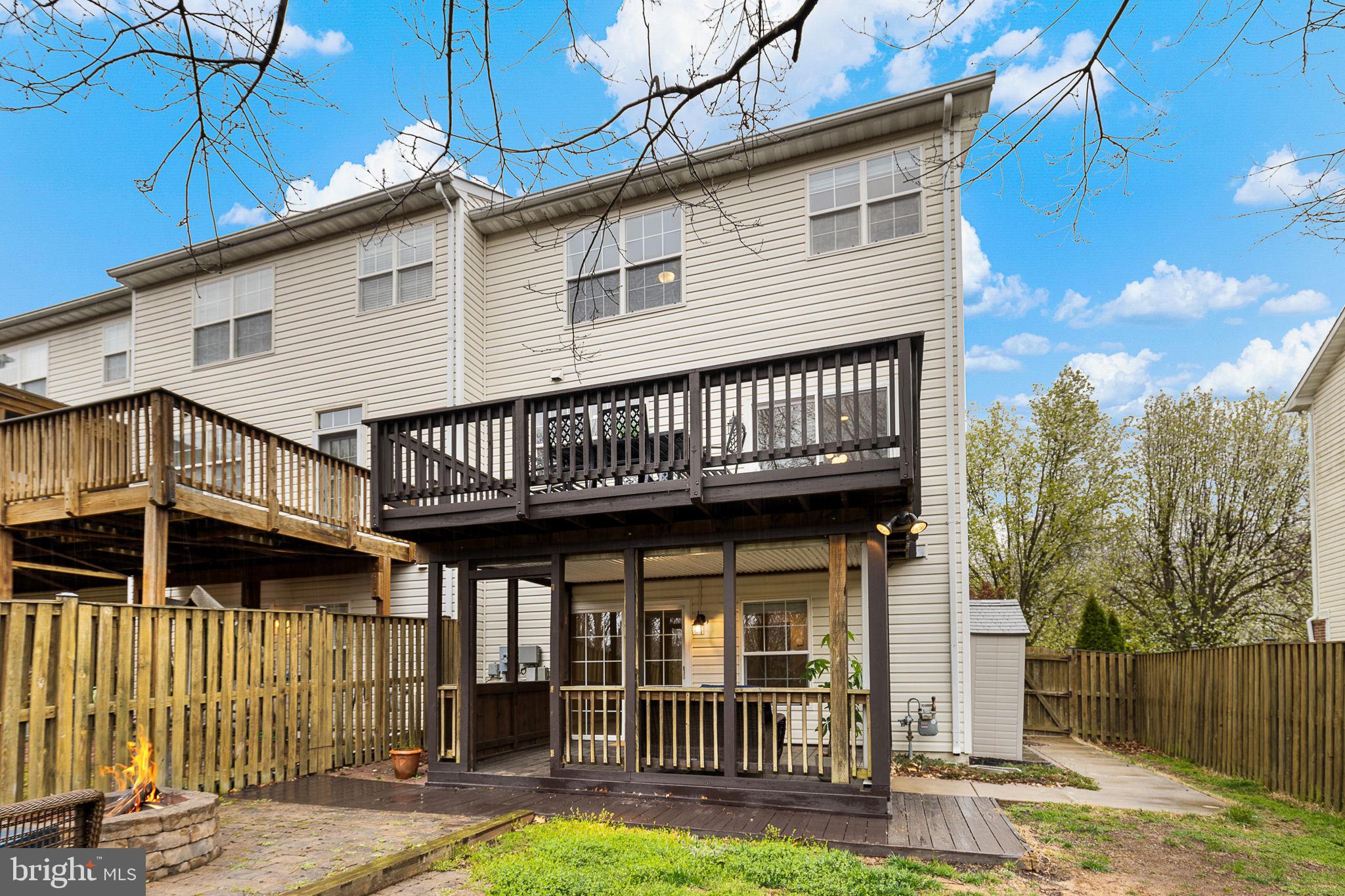 15686 Avocet Loop Woodbridge, VA 22191 - Photo 32 of 33 a view of a house with a yard and wooden fence