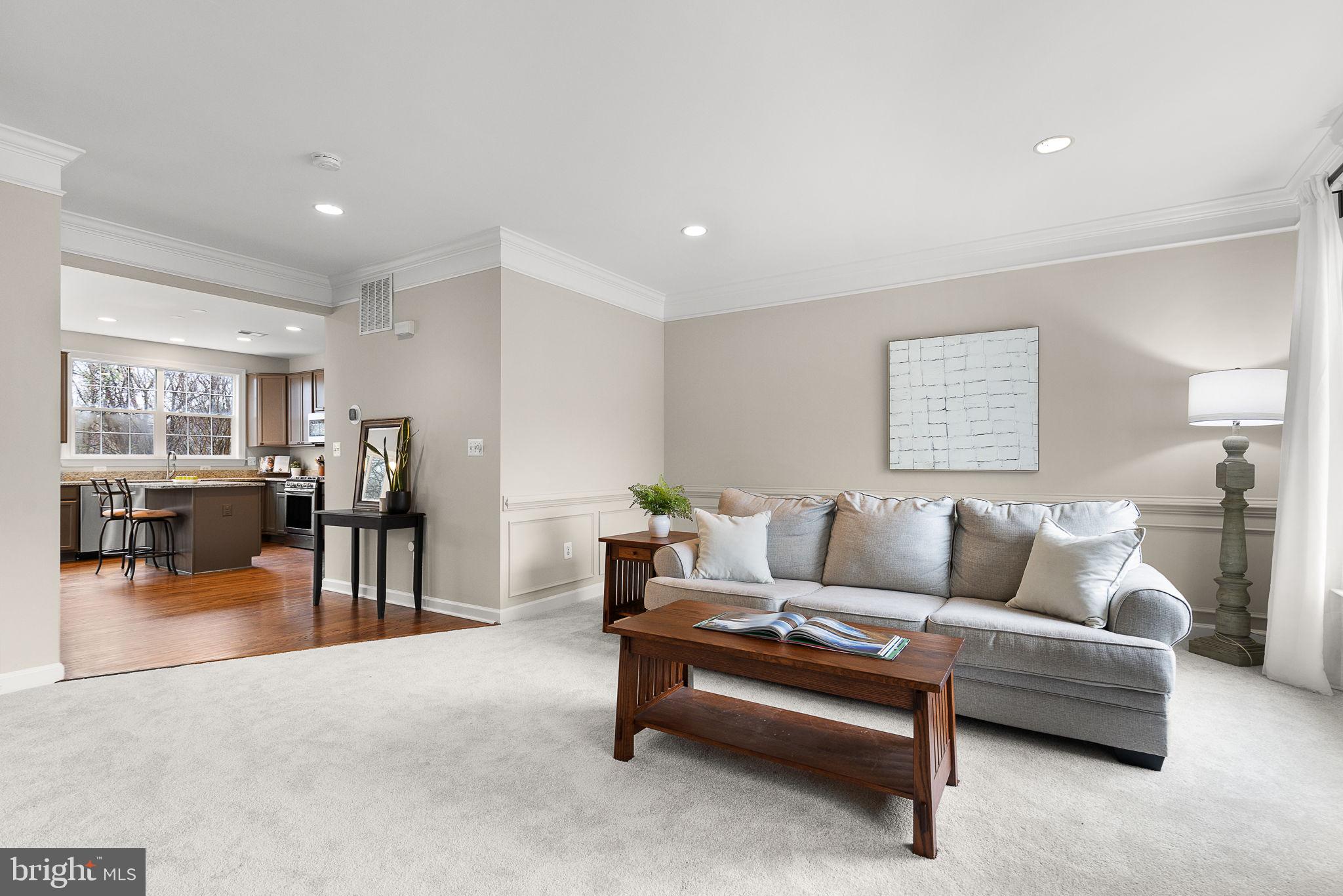 15686 Avocet Loop Woodbridge, VA 22191 - Photo 6 of 33 a living room with furniture and a table