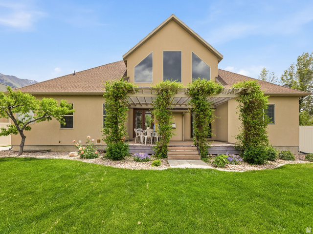 255 East 1200 North Mapleton, UT 84664 - Photo 26 of 37 Expansive backyard featuring a large green lawn and landscaped garden beds