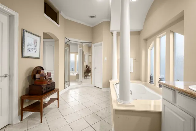 a bathroom with a bathtub and a shower