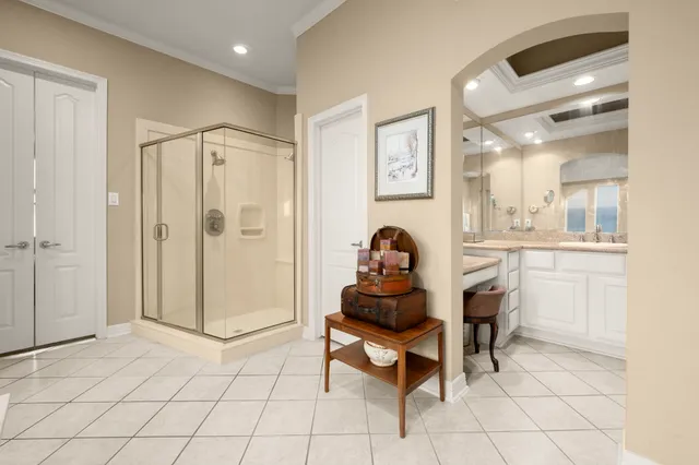a living room with furniture a fireplace and a large window