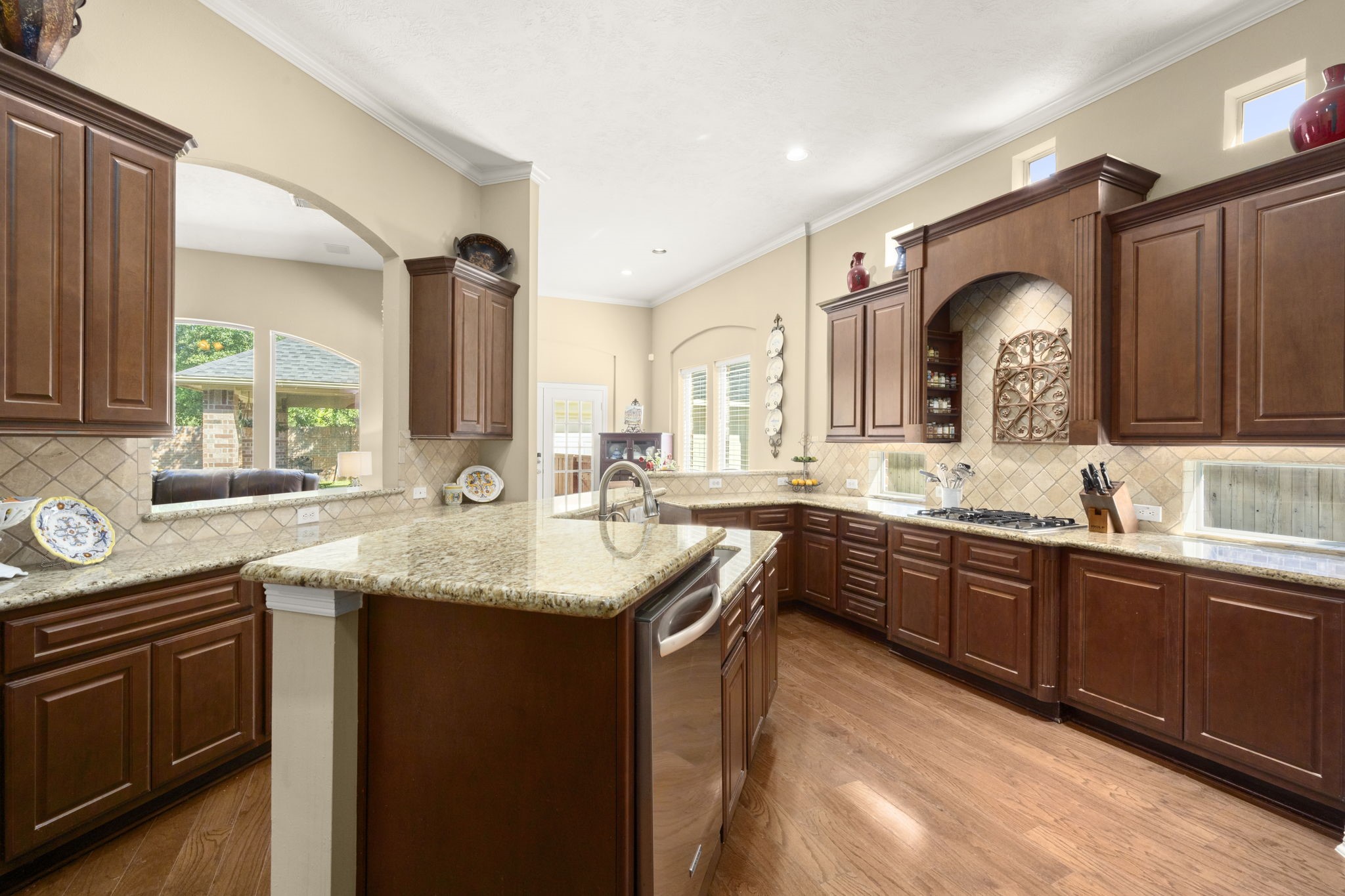 19902 Tidy Tips Lane Spring, TX 77379 - Photo 22 of 50 a kitchen with a sink stove and cabinets