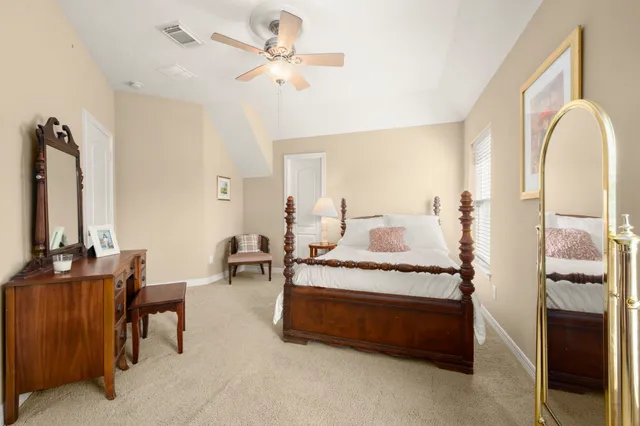 a bedroom with bed and a window