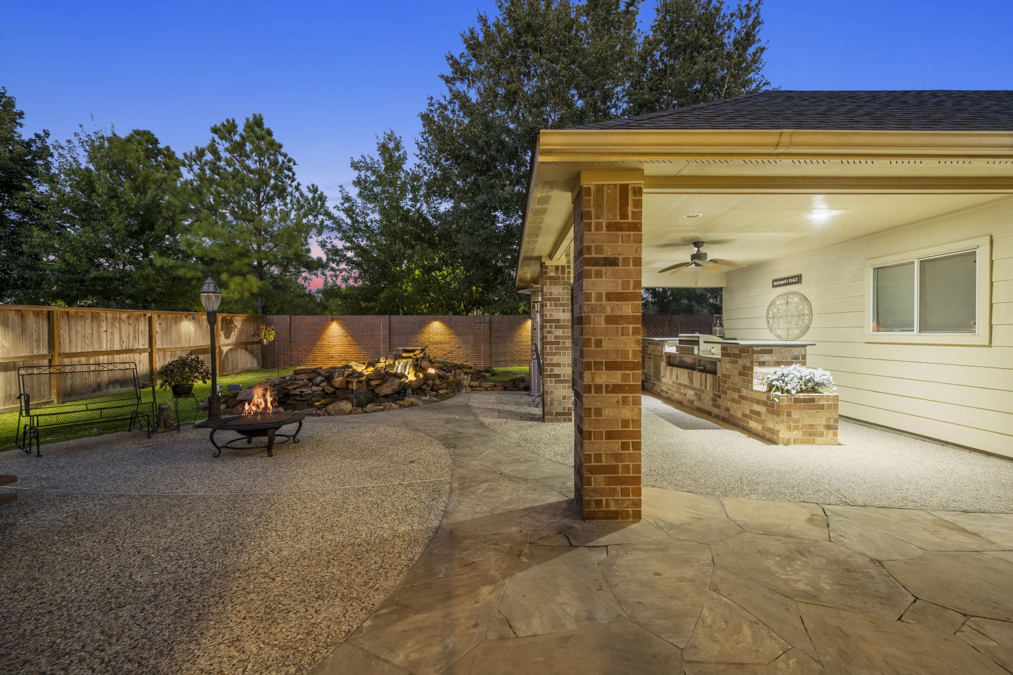 19902 Tidy Tips Lane Spring, TX 77379 - Photo 5 of 50 a view of a patio with table and chairs a barbeque next to a yard