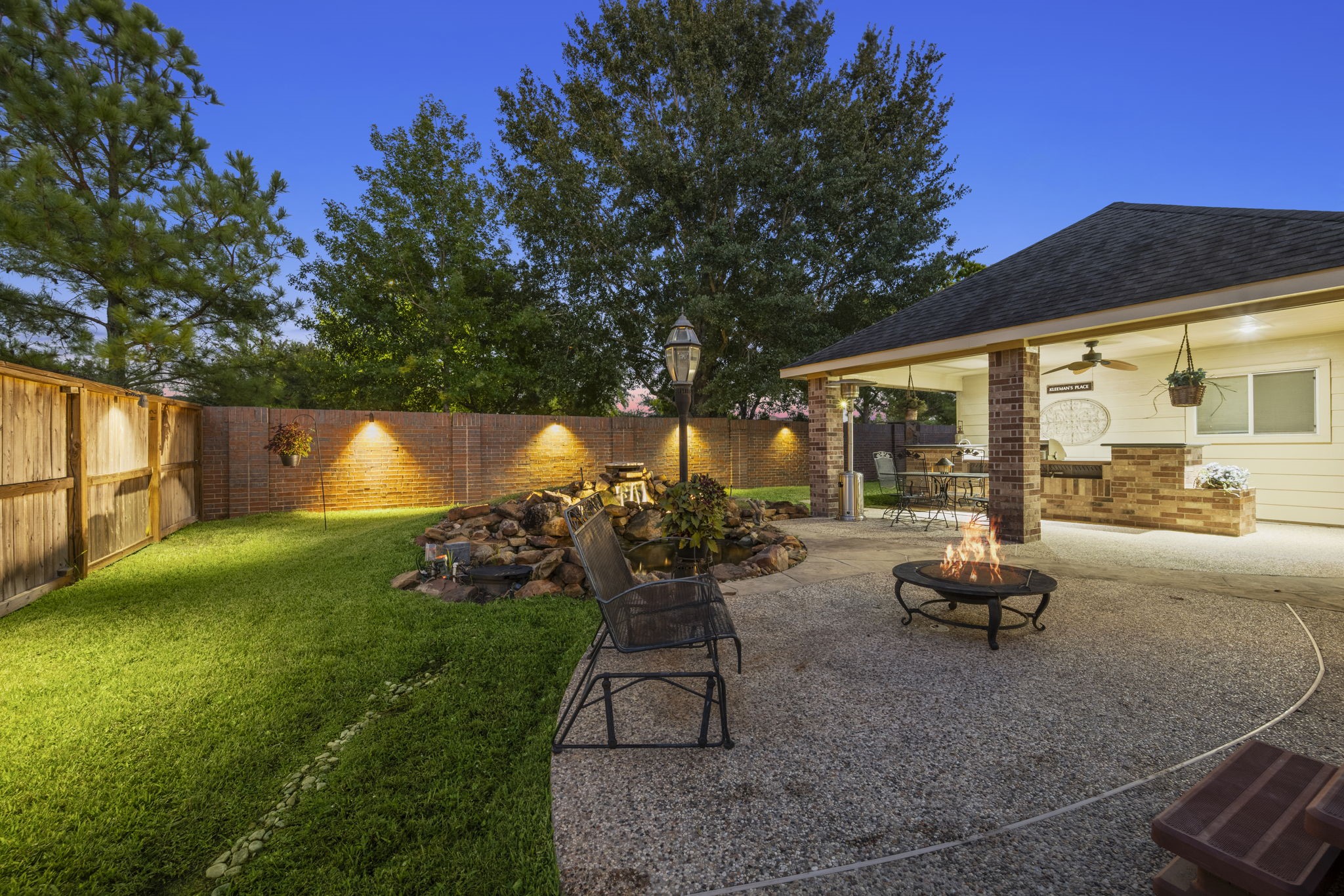 19902 Tidy Tips Lane Spring, TX 77379 - Photo 6 of 50 a backyard of a house with table and chairs