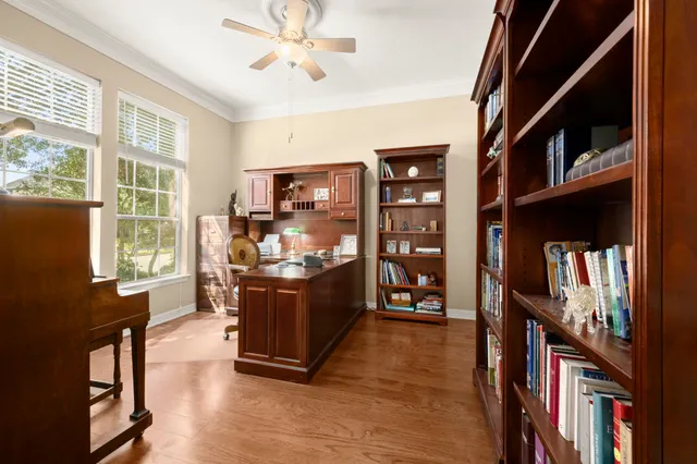 a living room with hard wood floors and a window