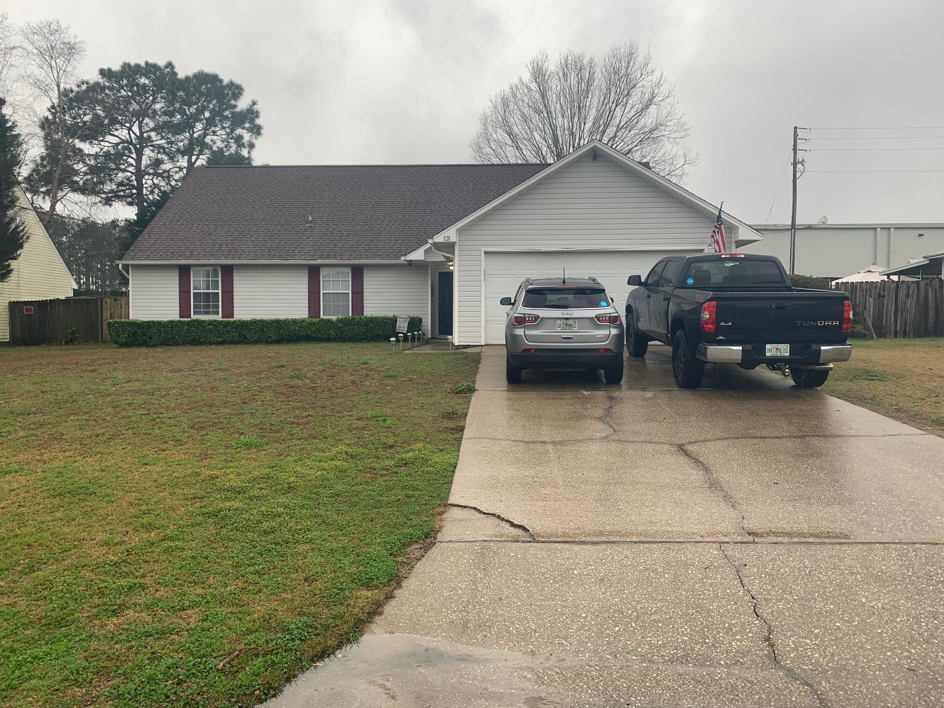 a car parked in front of a house