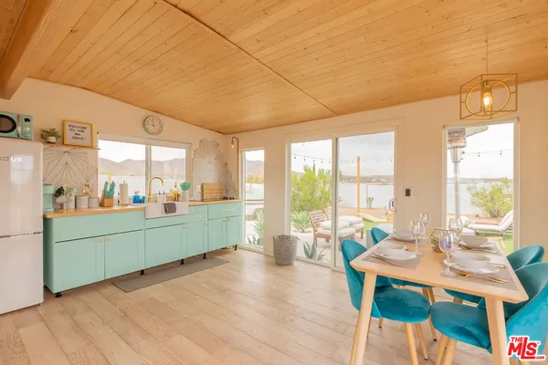 a room with furniture and large windows