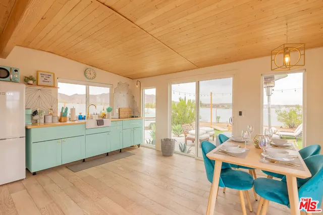 a room with furniture and large windows