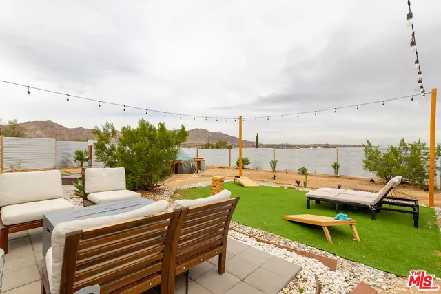 a view of a patio with swimming pool