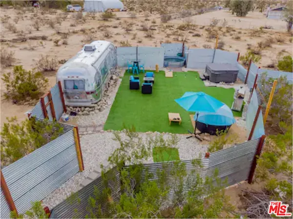 an aerial view of a house with outdoor space