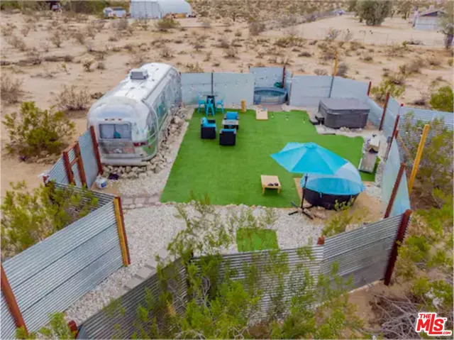 an aerial view of a house with outdoor space