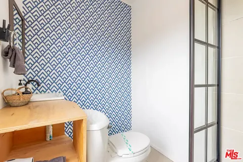 a bathroom with a sink and mirror