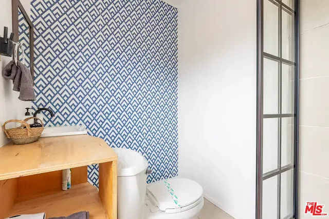 a bathroom with a sink and mirror