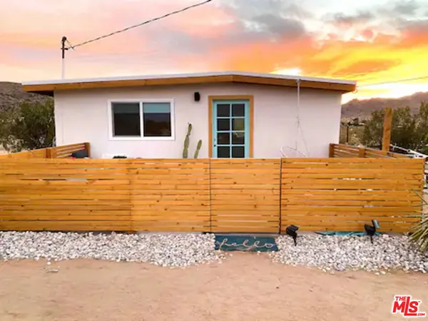 a front view of a house with a ocean view