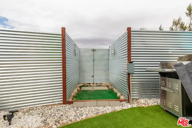 a view of a chairs in a back yard