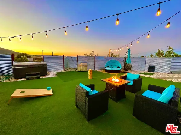 a view of a back yard from a balcony