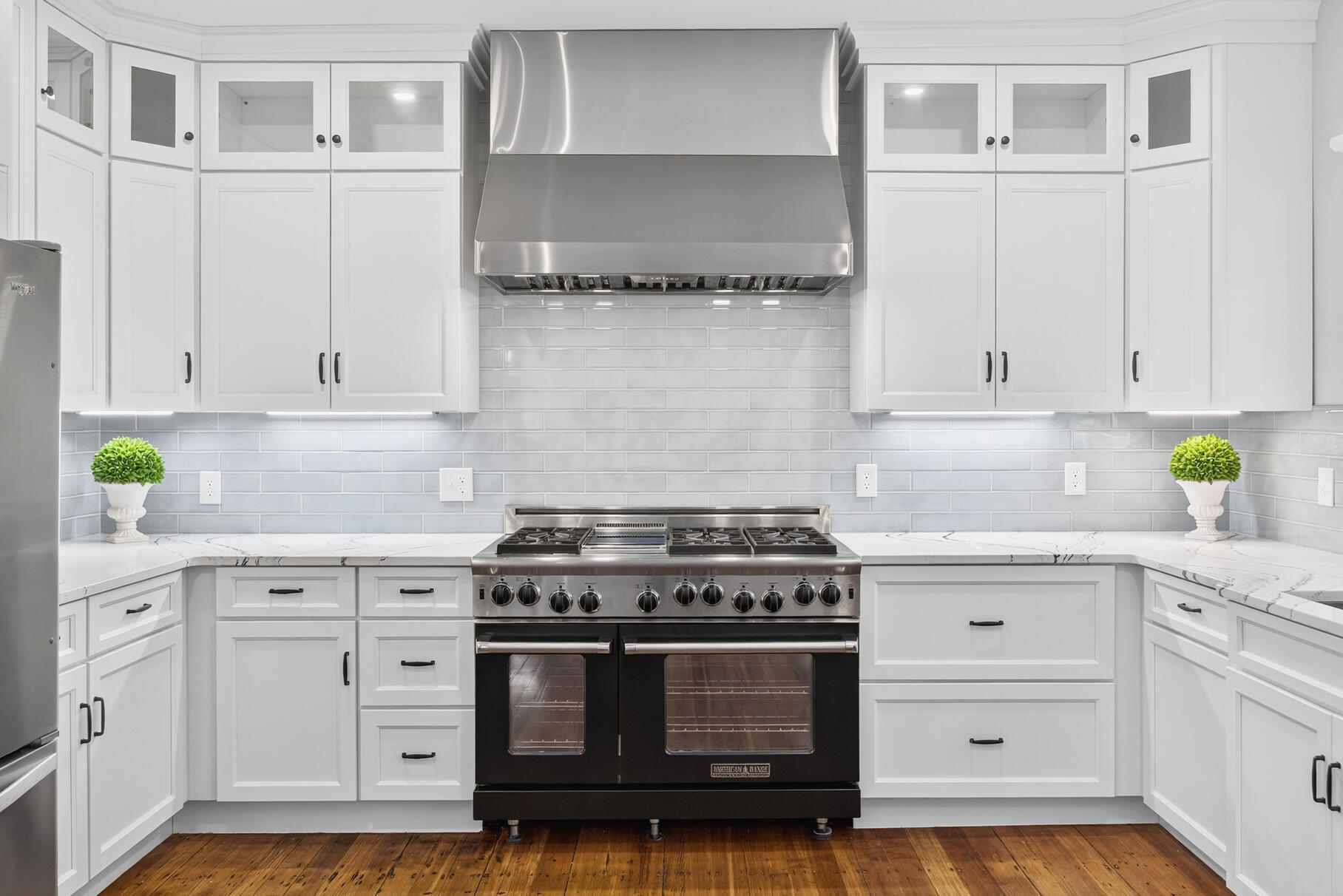48 Red Brook Harbor Road Pocasset, MA 02559 - Photo 15 of 59 a kitchen with cabinets appliances and a wooden floor