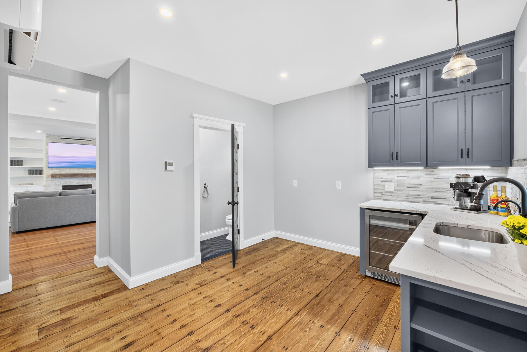 48 Red Brook Harbor Road Pocasset, MA 02559 - Photo 17 of 59 a kitchen with wooden floors and wooden cabinets