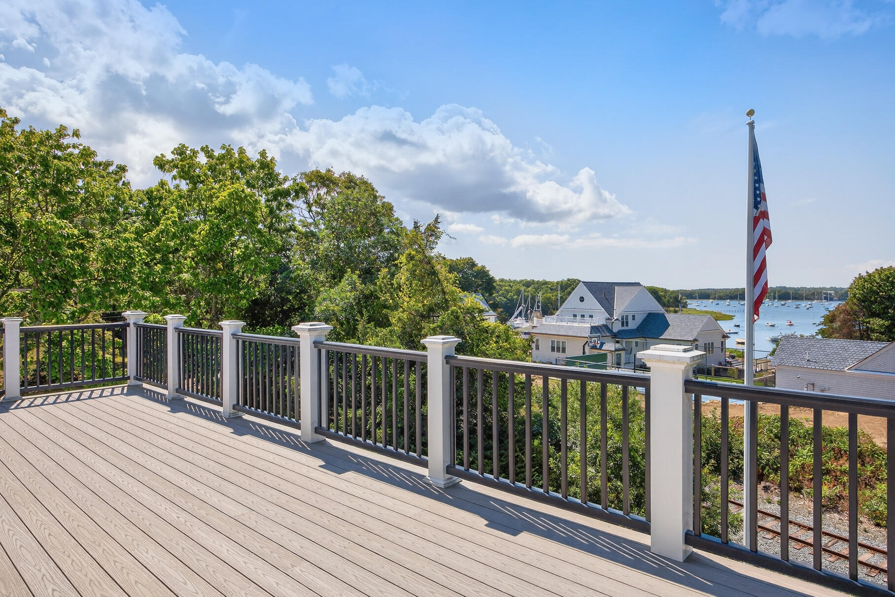 48 Red Brook Harbor Road Pocasset, MA 02559 - Photo 2 of 59 a view of a balcony with wooden floor and fence