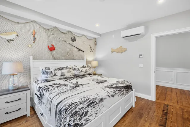 a spacious bedroom with a large bed and a window