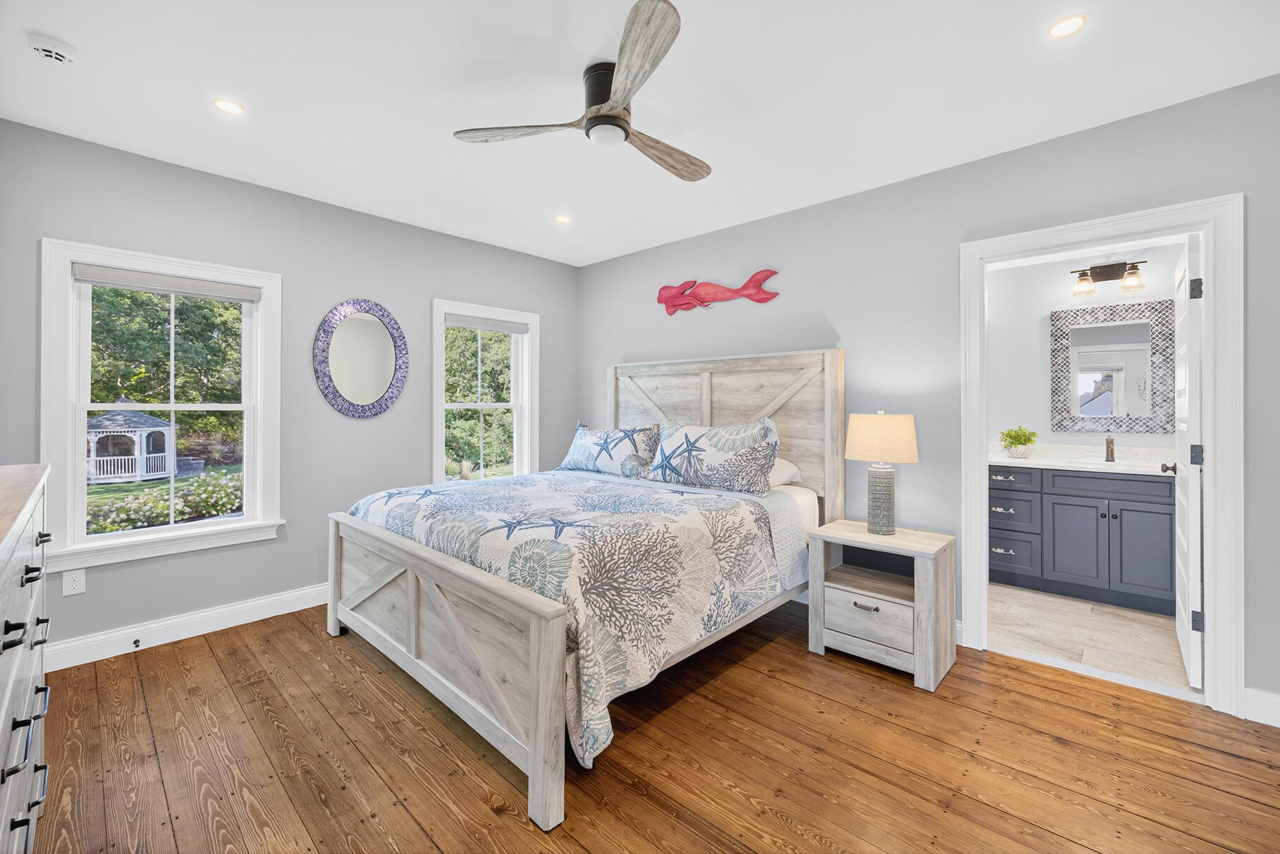 48 Red Brook Harbor Road Pocasset, MA 02559 - Photo 31 of 59 a bedroom with a large bed and a dresser