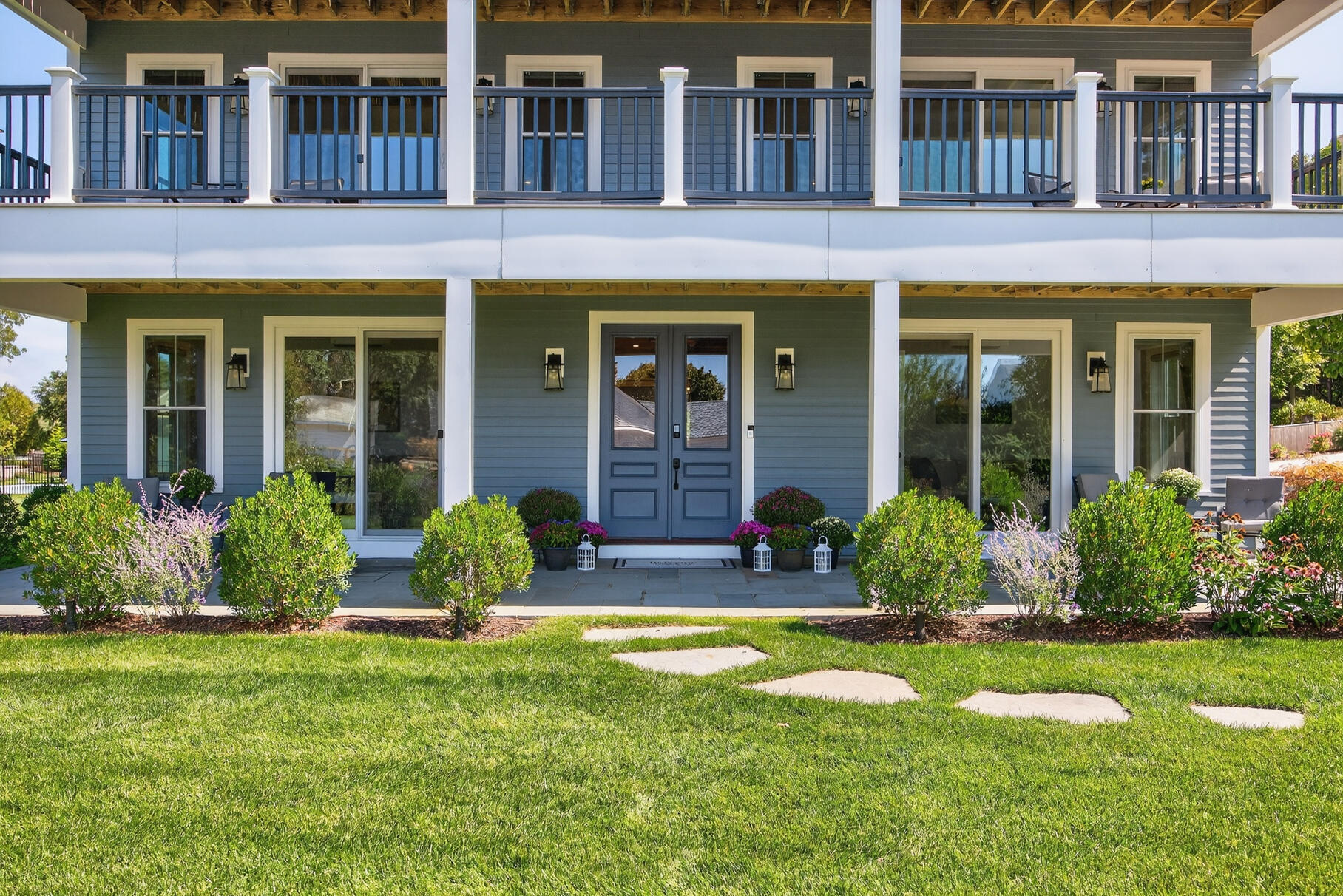 48 Red Brook Harbor Road Pocasset, MA 02559 - Photo 5 of 59 front view of a brick house with a yard pool and a large tree