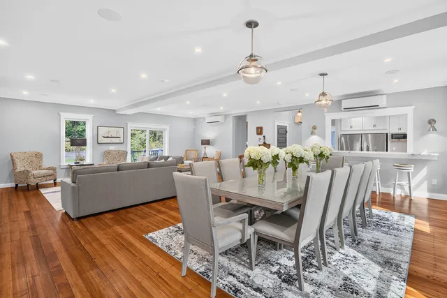 a kitchen with stainless steel appliances granite countertop a stove and white cabinets