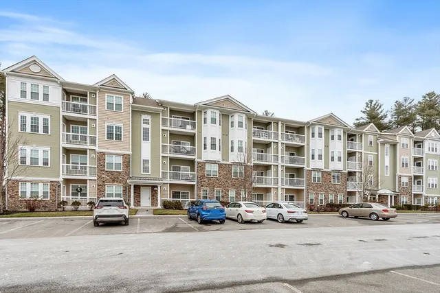 a car parked in front of a big building