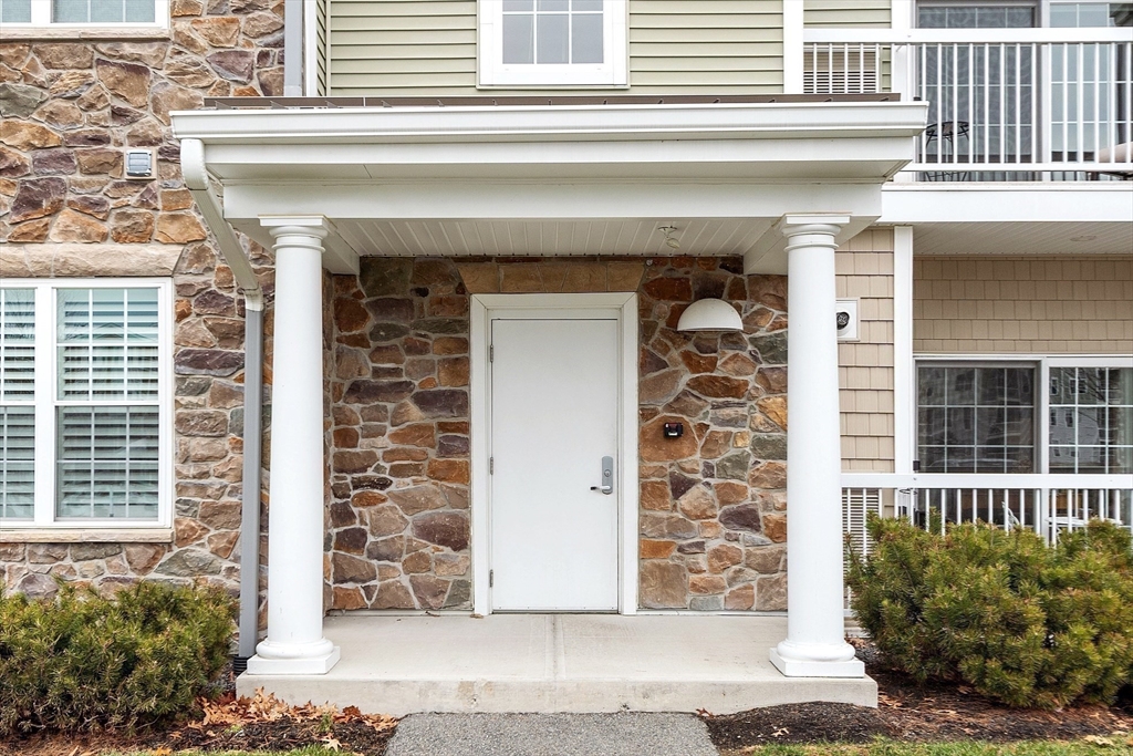 200 Martins Landing, Unit 102 North Reading, MA 01864 - Photo 24 of 33 a front view of a building