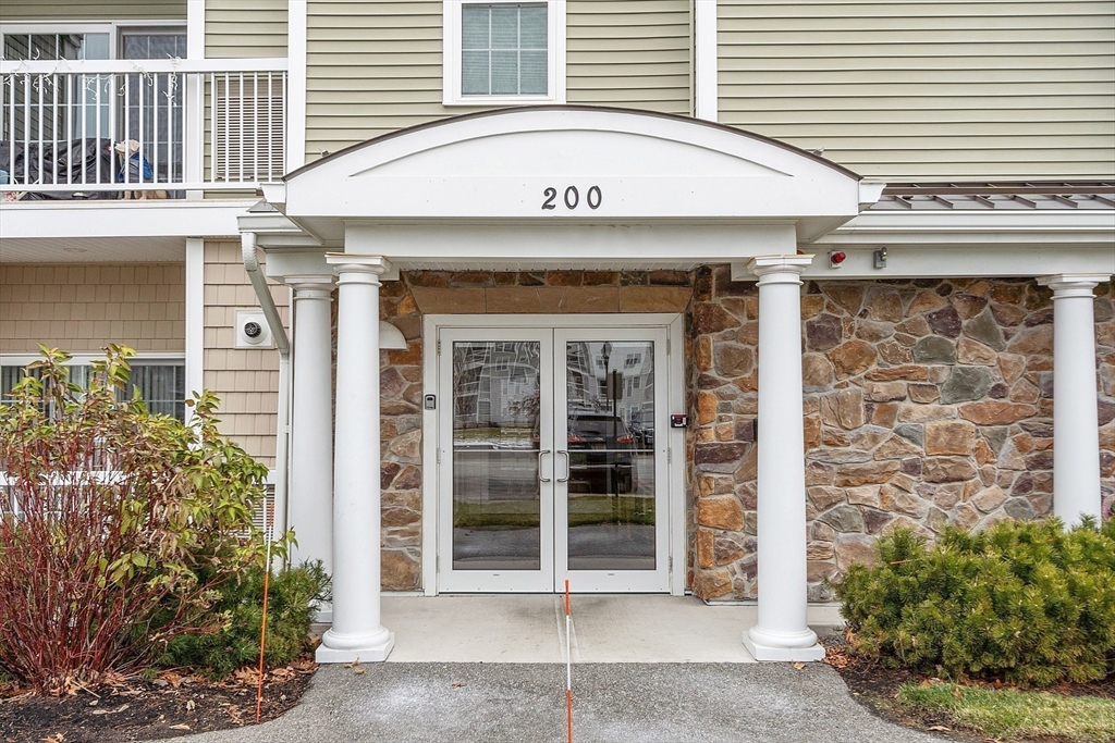 200 Martins Landing, Unit 102 North Reading, MA 01864 - Photo 3 of 33 a view of a entryway door front of house