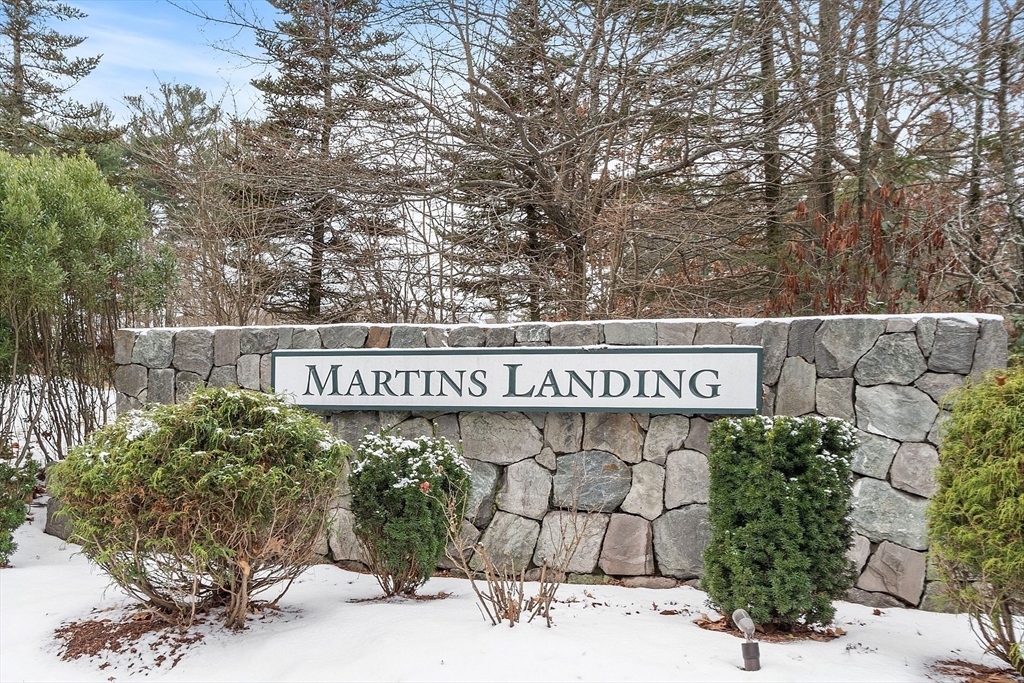 200 Martins Landing, Unit 102 North Reading, MA 01864 - Photo 33 of 33 a street sign that is on a pole