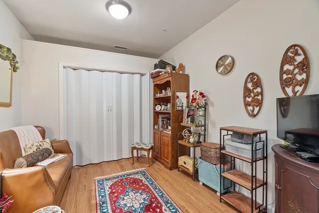 a living room with furniture and a window