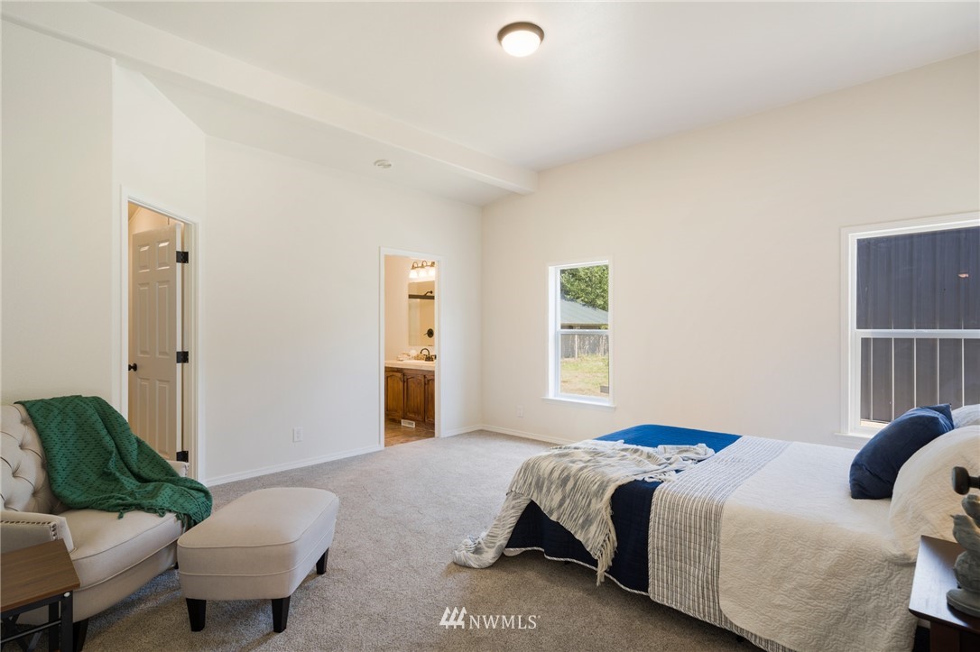 29122 Cedar Ponds Road Monroe, WA 98272 - Photo 13 of 25 a bedroom with a bed and a couch