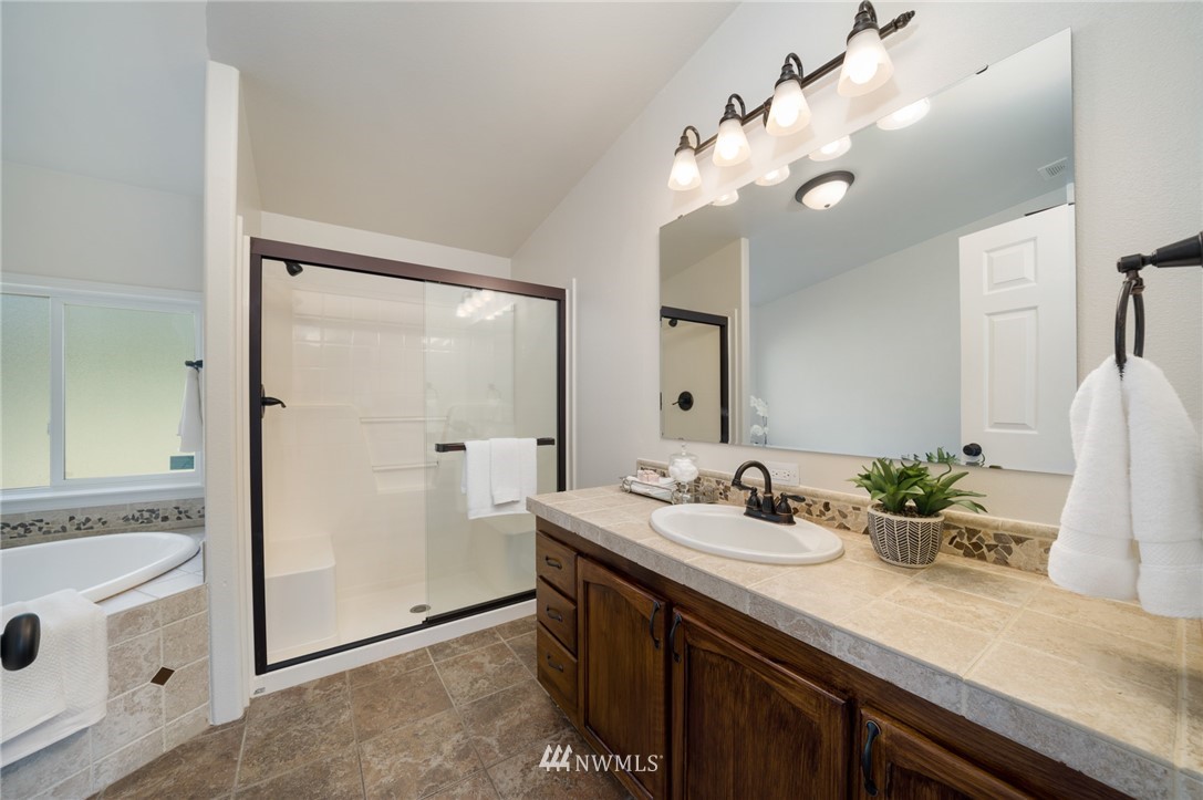 29122 Cedar Ponds Road Monroe, WA 98272 - Photo 14 of 25 a bathroom with a double vanity sink mirror and shower