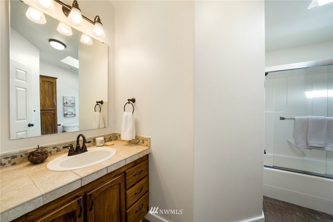 29122 Cedar Ponds Road Monroe, WA 98272 - Photo 15 of 25 a bathroom with a sink and a mirror