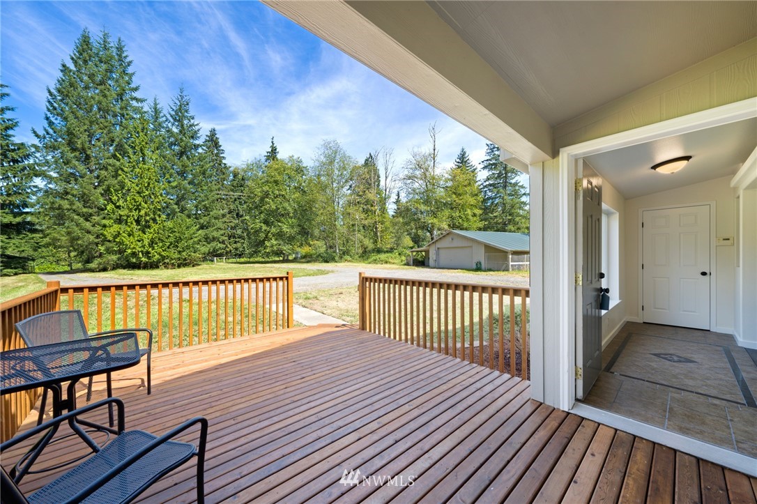 29122 Cedar Ponds Road Monroe, WA 98272 - Photo 4 of 25 a view of a wooden deck with a yard