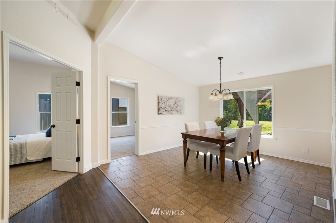 29122 Cedar Ponds Road Monroe, WA 98272 - Photo 7 of 25 a dining room with furniture window and wooden floor