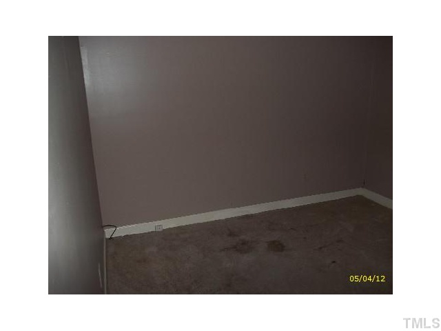 7004 Sandringham Drive Raleigh, NC 27613 - Photo 4 of 8 a black and white photo of a room