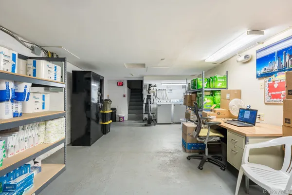 a view of a workspace with furniture