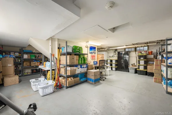 a bedroom with furniture and a gym equipment